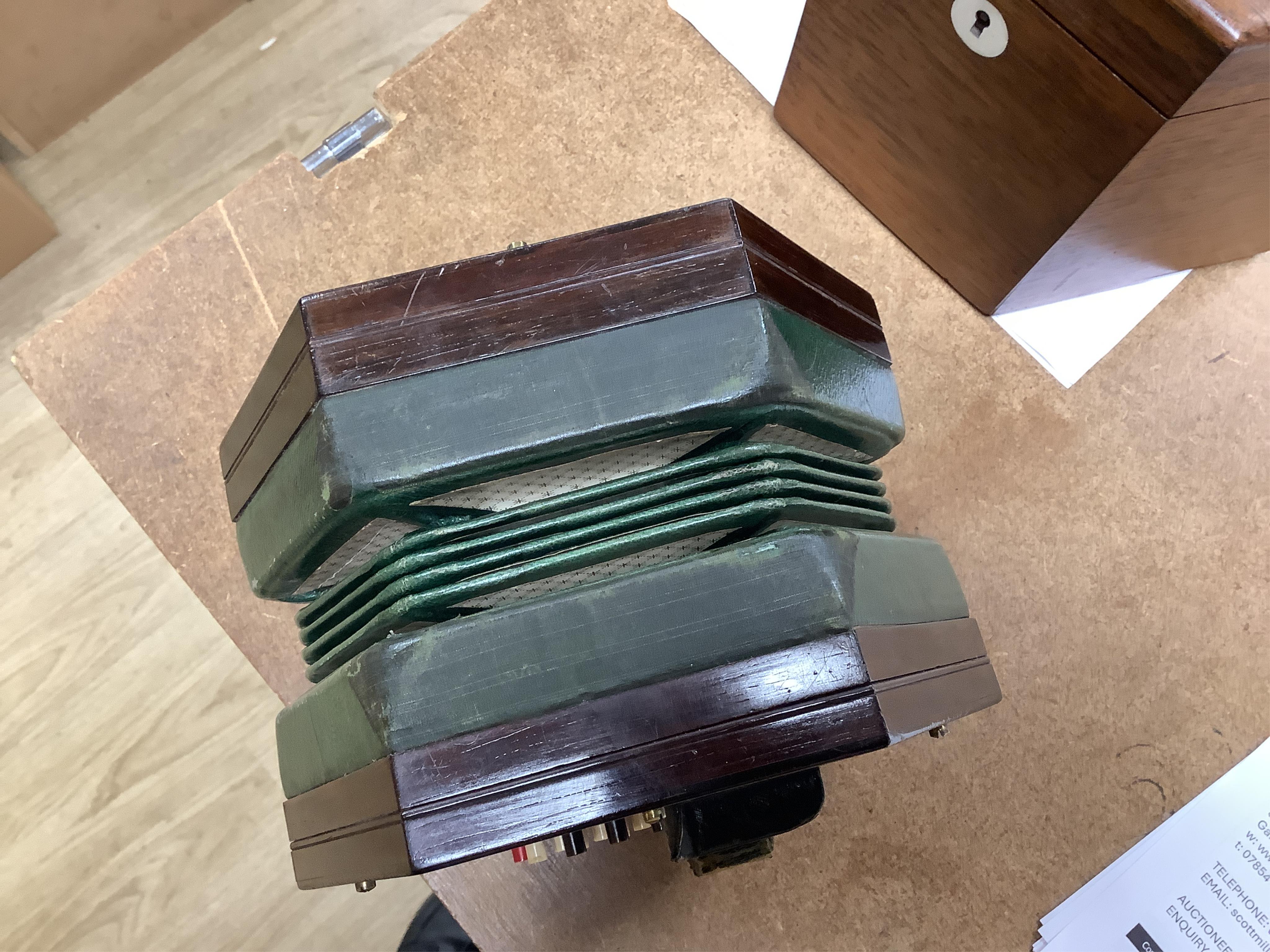 A Wheatstone concertina, in rosewood case, case 16.5cm high. CITES Submission reference, PS7AQEEA